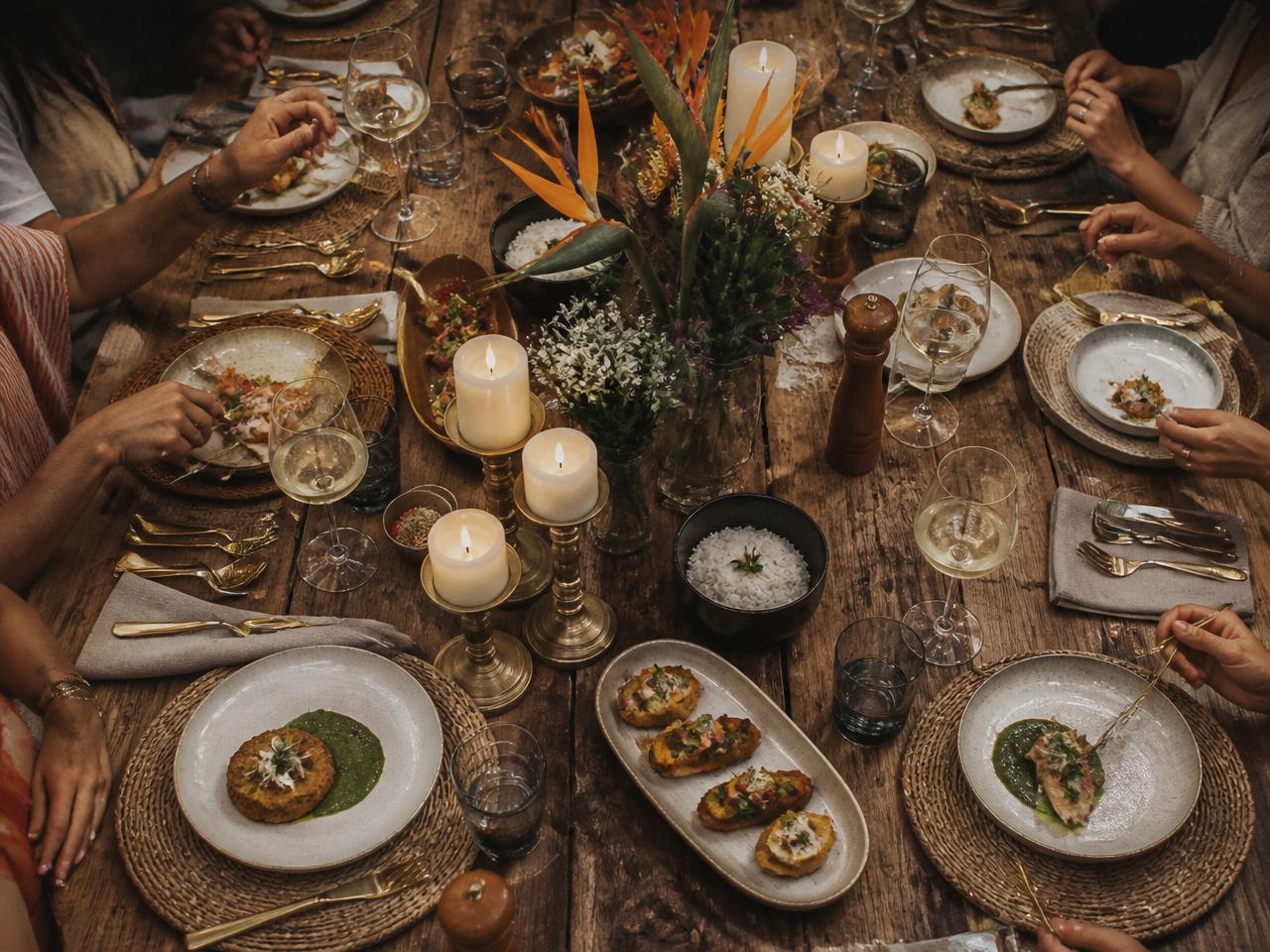 Designers around a beautifully set dinner table